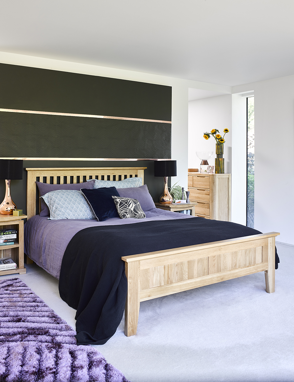 Bedroom with purple bedding and black walls