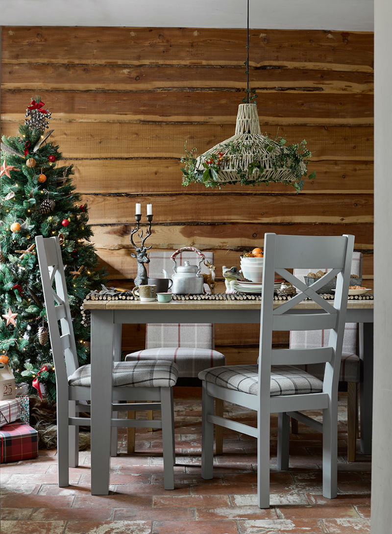 grey painted dining set in christmas themed kitchen