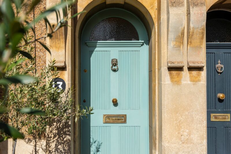 Front doors-outdoors-blue front door-stone frontage-garden foliage