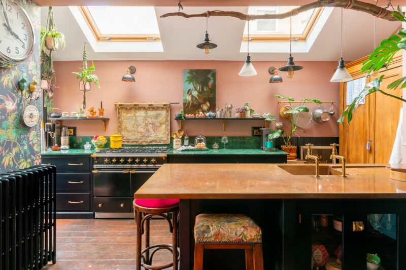 Kitchen units and work tops-kitchen furniture-copper topped kitchen island-green kitchen units-pink walls-floral wallpaper