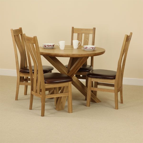 The Solid Oak Round Table with Crossed Legs and Four Arched Back Chairs